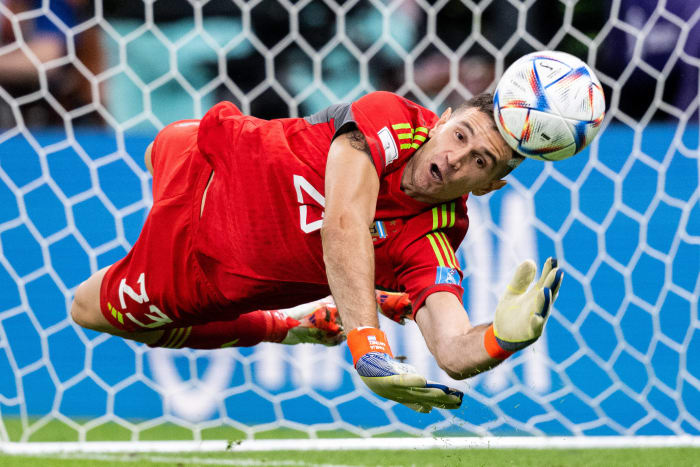 Argentina goalkeeper Emiliano Martinez pictured making a save during his side's penalty-shootout win over Holland at the 2022 World Cup